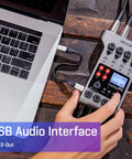 Person connecting PodTrak P4 Dope Podcast Recorder With 4 XLR Mic Inputs, 4 Headphone Outputs, to laptop via USB interface.