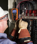 Electrician using Rare Earth Magnetic Hanger With Strap for Cat Nos CL120 CL220 CL320 CL390 CL445 in panel box.