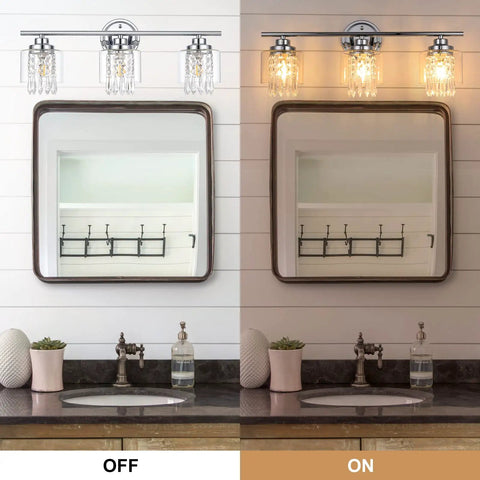 Lit Three Light Crystal Vanity Light Fixture for Bathroom with Clear Glass Shades, shown turned off and on above a mirror.