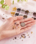 Hand holding components from Six Color Jewelry Finding Kit With 5mm Open Jump Rings And 12x6mm Lobster Claw Clasps For DIY Bracelet And Necklace Making Great Beading Supplies For Crafters And Jewelry Makers