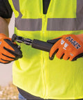 Person wearing knit dipped cut resistant work gloves with nitrile coated palms using a tool; ANSI A1 rating, nylon spandex stretch fit.