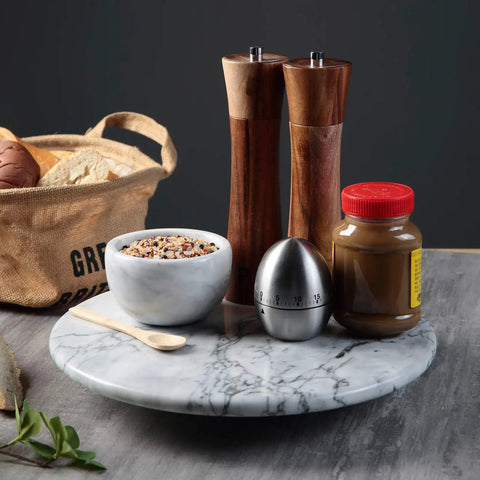 12 Inch Solid Marble Lazy Susan Turntable with spices and condiments for kitchen countertop organization.