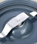 Close-up of flat extractor grinder blade for Nutribullet 600W and 900W, dishwasher safe, made of food-grade stainless steel.