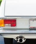 Rear view of car with Edgy Barbed Wire Design License Plate Frame With Screws, Silver Chain Link Style Plate Frame For Cars And Trucks installed
