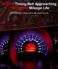 Timing Belt approaching 100,000 km displayed on car dashboard in red lighting
