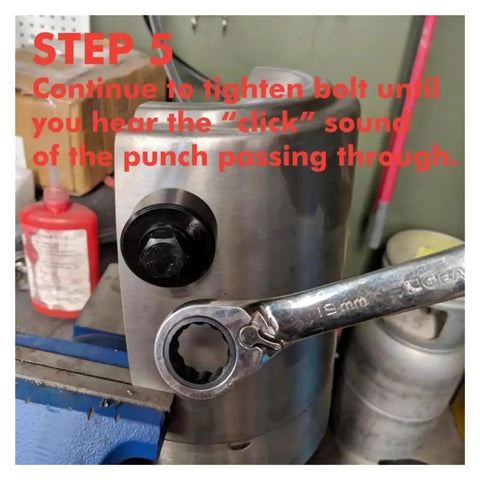 22mm And 20mm Hole Punch Kit with Knockout Die and Punch Set in use with wrench tightening bolt in metal sheet.