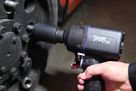 Professional 1/2 Inch Impact Wrench Featuring Generation 2 Thor Model close-up view with user, showcasing grip and anvil for metal work.