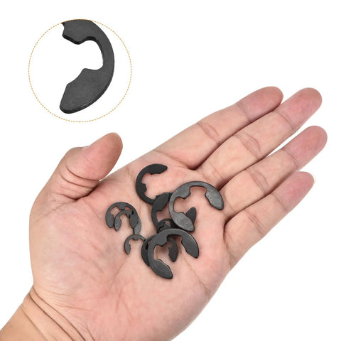 Hand holding 200 Pcs E Clip Circlip External Retaining Rings Kit With Ten Sizes M1 5 To M10 In 65Mn Carbon Steel Snap Rings