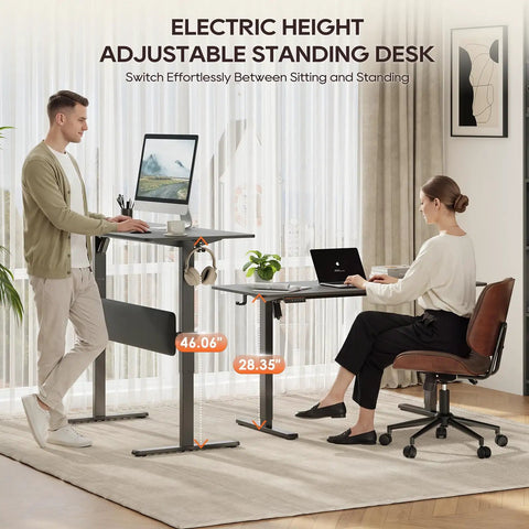 MALOL 56 Inch Electric Standing Desk With Adjustable Footrest Black height adjustable office computer table in home setting.
