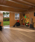 Interior view of 10x12 Ft Heavy Duty Metal Outdoor Storage Shed With Lockable Sliding Door Windows And Ventilation Weatherproof Garden Shed For Backyard Lawn Tools Equipment And Pet Shelter Go To Backyard Storage Solution showing organized tools and wooden floor.