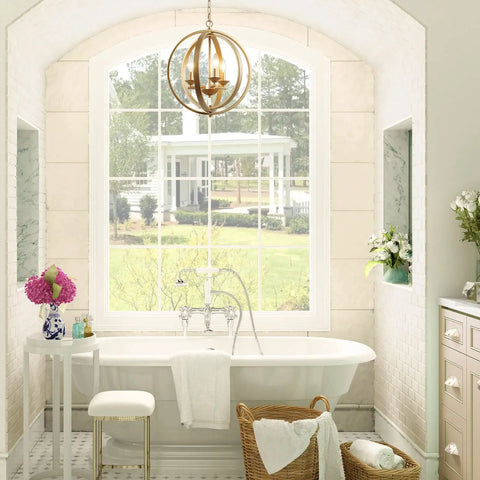 Gold Orb Chandelier With Openwork Globe Spheres Modern 3 Light Fixture for bathroom over elegant bathtub scene