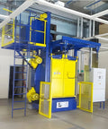 Hook Type Shot Blasting Machine For Livestock Machinery Parts Treating Feed Mixer Components And Barn Equipment Frames In Livestock Farming Workshops With Pro Grade Finish And Easy Access Ladder, blue and yellow industrial unit