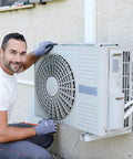 Heavy Duty Mini Split Wall Mount Bracket Built Like A Tank For 7000 To 18000 BTU AC Units; technician installing a condenser.