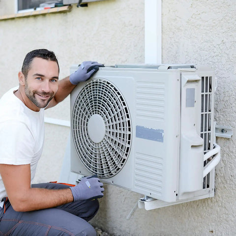 Heavy Duty Mini Split Wall Mount Bracket Built Like A Tank For 7000 To 18000 BTU AC Units; technician installing a condenser.