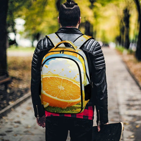 Dope Summer Fruit Print Unisex Backpack With Orange Lemon Lime Pattern held by a person outdoors