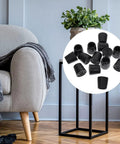 Slip On Chair Leg Protectors 20 Pack for Hardwood Floors in living room next to a chair, showcasing black elastic iron and PVC pads.
