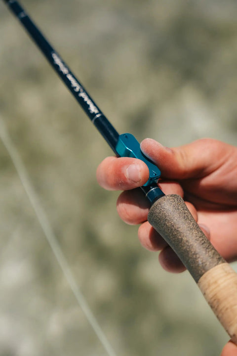 User gripping Mag Grab Rod Rack Magnetic Fishing Rod Holder Black Quick-Access One-Hand Mount for easy lure changes.