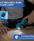 Hand using Heavy Duty Cordless Electric Scissors With Led Light on cardboard, showcasing safety lock and protective guard features.