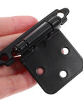 Close-up of Black Spring Hinges For Cabinet Doors With Dampers Smooth Closing Self Closing Hardware 1.4mm thick, held in hand