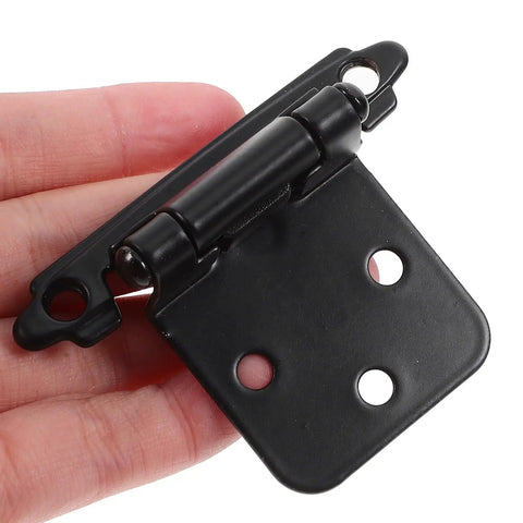 Close-up of Black Spring Hinges For Cabinet Doors With Dampers Smooth Closing Self Closing Hardware 1.4mm thick, held in hand