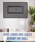 Hide Cable Clutter With An In Wall TV Power Kit Featuring Surge Protected Outlet And Recessed Wall Box, Easy Plug And Play, Cable Management For Behind The TV, Low Voltage Setup, White with plant and couch nearby.