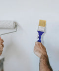 Adjustable 2 Inch Flat Tip Paint Brush For Walls And Wood Decks, Stain Brush With 270 Degree Angled Handle in use on wall