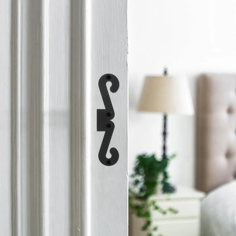 Premium Four Pack Carbon Steel Barn Door Hinge Hardware In Matte Black, shown installed on a white door frame.
