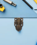 Cool 12 Pack Iron Wood Box Latches With Keyholes, Fancy Antique Toggle Buckles For Chests And Jewelry Boxes, Total Vibe Upgrade For Your Craft DIY Projects. Antique iron box latch with screws on blue background