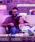 Couple using Color Changing Smart A15 LED Bulb With Dimmable WiFi Control in living room, compatible with Alexa and Google Assistant.