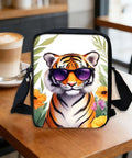 Hands Free Crossbody Sling Bag For Women And Men Ultra Lightweight Everyday Chest Pack With Adjustable Strap And Zipper Small Messenger Style Bag For Travel Work And Daily Use Tiger Print With Sunglasses displayed on a table
