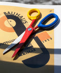 Chroma Scissors 8.5 Inch Heavy Duty Stainless Steel All Purpose Shears For Office Craft And Home Use With Ultra Sharp Blade And Ergonomic Comfort Grip Handles In Bold Red Color For Smooth Cutting And Everyday DIY Ready Workhorse, red handles on printed paper