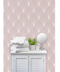 Pink geometric stripes leather texture vinyl wallcovering in a stylish bathroom setting with white towels and a mirror.