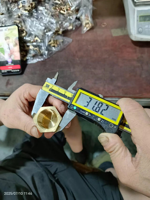 Brass 3/4 in NPT female pipe cap with hex head, close-up view.