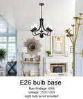 Affordable Luxury Five Light Farmhouse Chandelier In Classic Black Finish hanging in a living room with clear glass shades