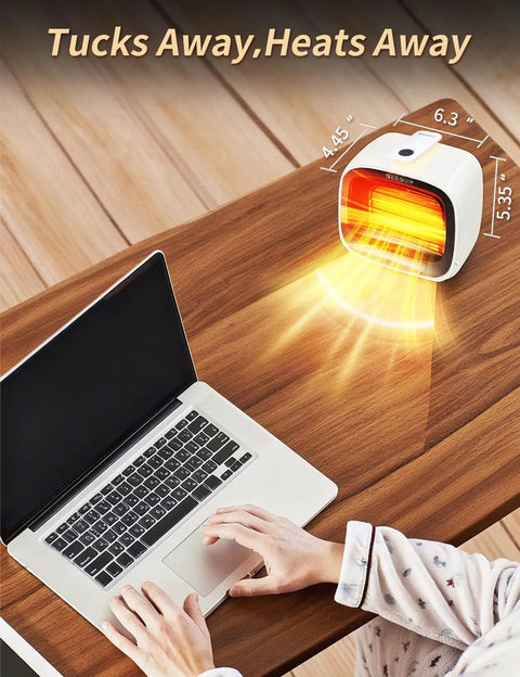 Compact 1200W Space Heater With Magnetic Remote Cranking Heat White Desk Friendly Portable Heating For Small Rooms Fast PTC Heat Overheat Protection Tip Over Safety Perfect For Bedroom And Office on desk next to laptop