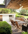 Keep It Chill With This Dope 84 Inch Smart Ceiling Fan Engineered For Indoor Or Outdoor Zones With Whisper Quiet Motors Alexa Connectivity Bluetooth Senseme Tech And Sleek Black Finish For Spacious Family Gatherings At Home. Outdoor dining area with wooden table and chairs, featuring a white ceiling fan.