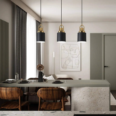 Modern Cylindrical Pendant Chandelier Black Finish With Vintage Farmhouse Vibe Dope Yet Sleek Hanging Light Diameter Five Point Eleven Inches For Kitchen Island Kitchen Sink Dining Room Bedroom Hallway Or Corridor Decor over a dining table.