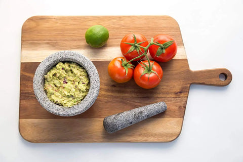 Heavy Granite Mortar And Pestle Set 2 Cup Capacity For Spices Herbs Seasonings Pastes Pesto And Guacamole on cutting board
