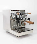 Pro Grade Dual Boiler Espresso Maker With PID Precision Tuning Hardened Stainless Frame, angled view showing chrome finish and wooden handles.