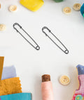Vintage Heavy Duty Safety Pins For Sweaters And Cardigans Retro Iron Metal Decorative Brooch Clips on a craft table.