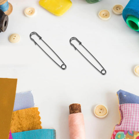 Vintage Heavy Duty Safety Pins For Sweaters And Cardigans Retro Iron Metal Decorative Brooch Clips on a craft table.