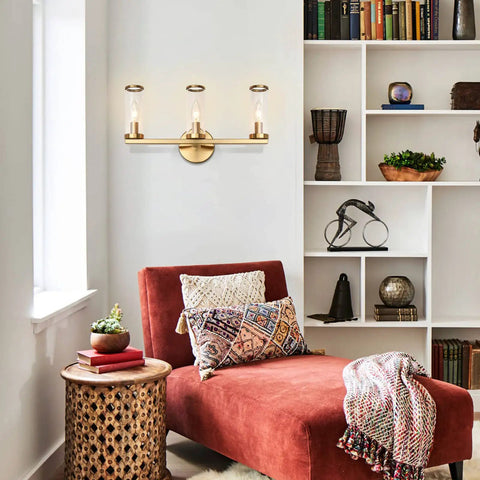 Brushed Gold 3 Light Vanity Light Fixture For Bathroom And Hallway Brass Bath Lighting With Glass Cylinders over a cozy reading nook