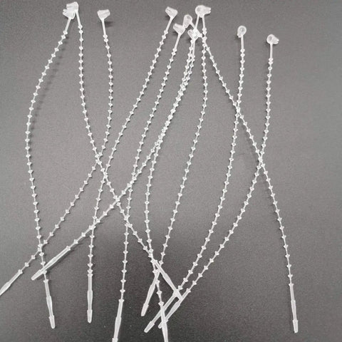 One Thousand Pack Of 5 Inch Adjustable Security Beaded Loop Ties With Snap Lock Pins Ideal For Retail Price Tags And Shipping Seals, clear plastic ties.
