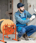 Worker using Heavy-Duty Adjustable Wire Dispenser And Welded Steel Spool Rack For Heavy Cables Portable Cable Caddy on site