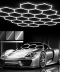 Hexagon Garage Light System With 22 Grids 3 Level Dimmable 581W 63910LM LED Hexagonal Shop Light above a sports car