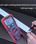 Pro Grade Digital Multimeter With TRMS 6000 Counts Reads 1000V AC DC testing LED with probes on hands