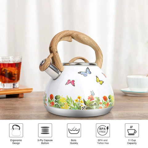 Stovetop Tea Kettle With Wood Pattern Handle, Loud Whistle, 2.7 Quart Food Grade Stainless Steel Pot For Induction And Gas Stoves, Butterfly Design, Rust Resistant, Easy Pour Tea Maker on a kitchen counter.