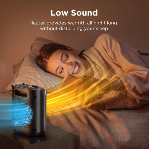 Person sleeping with 1500W Ceramic Space Heater For Desk And Office emitting quiet, cozy warmth on a bedside table