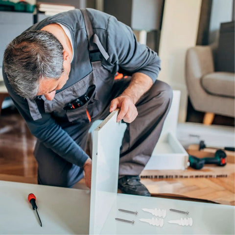 Man assembling furniture using Drywall Anchors And Screws Kit 50 Sets Easy Install Stainless Steel And Plastic Construction For Hanging Mirrors And Shelves