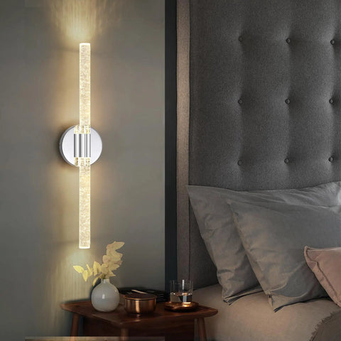 Gold Bubble Crystal Wall Sconce With LED Vanity Light next to bed, with dimmable brass finish, cozy lit glow